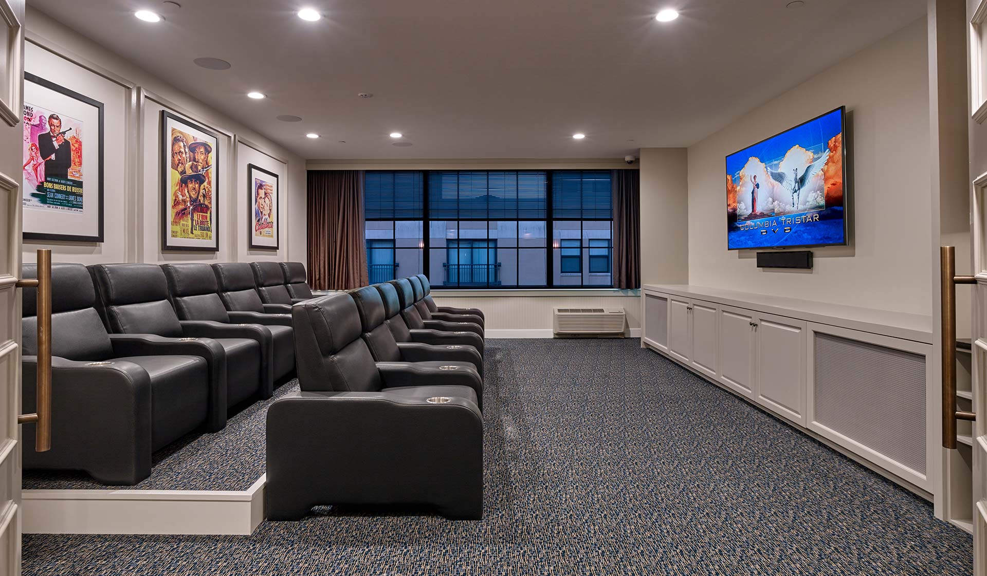Theatre room with large screen TV and stadium seating