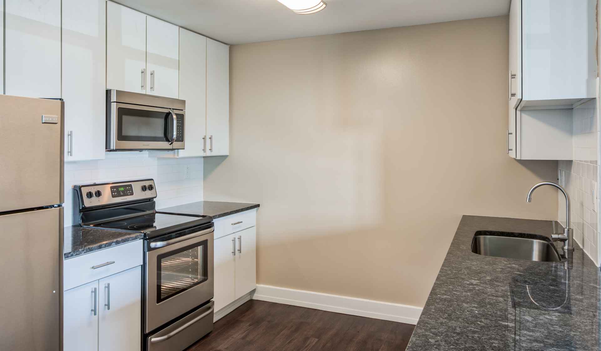 Kitchens with stainless steel appliances and granite countertops